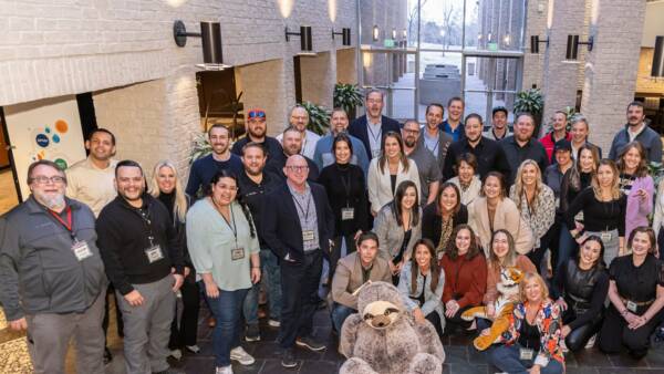 group of team members posing during a conference