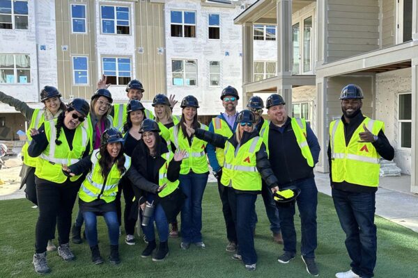 RedPeak team members posing together with vests and hard hats.
