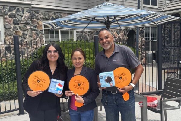 RedPeak employees smiling and posing together at social event.