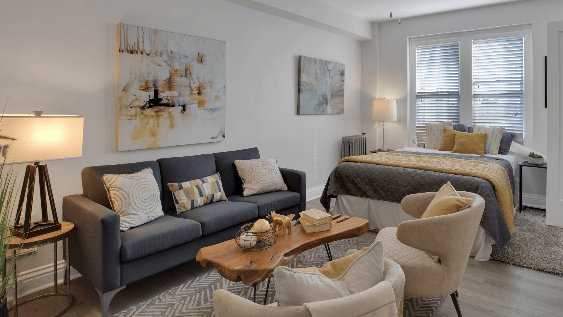 studio apartment with bed and couch and living area