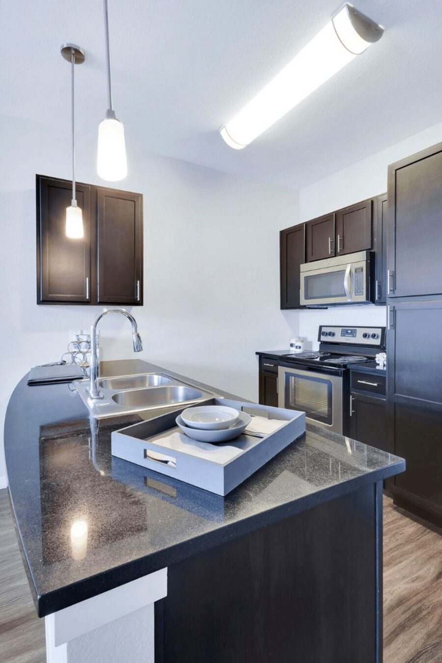 kitchen with nine foot ceilings and mocha-stained cabinets