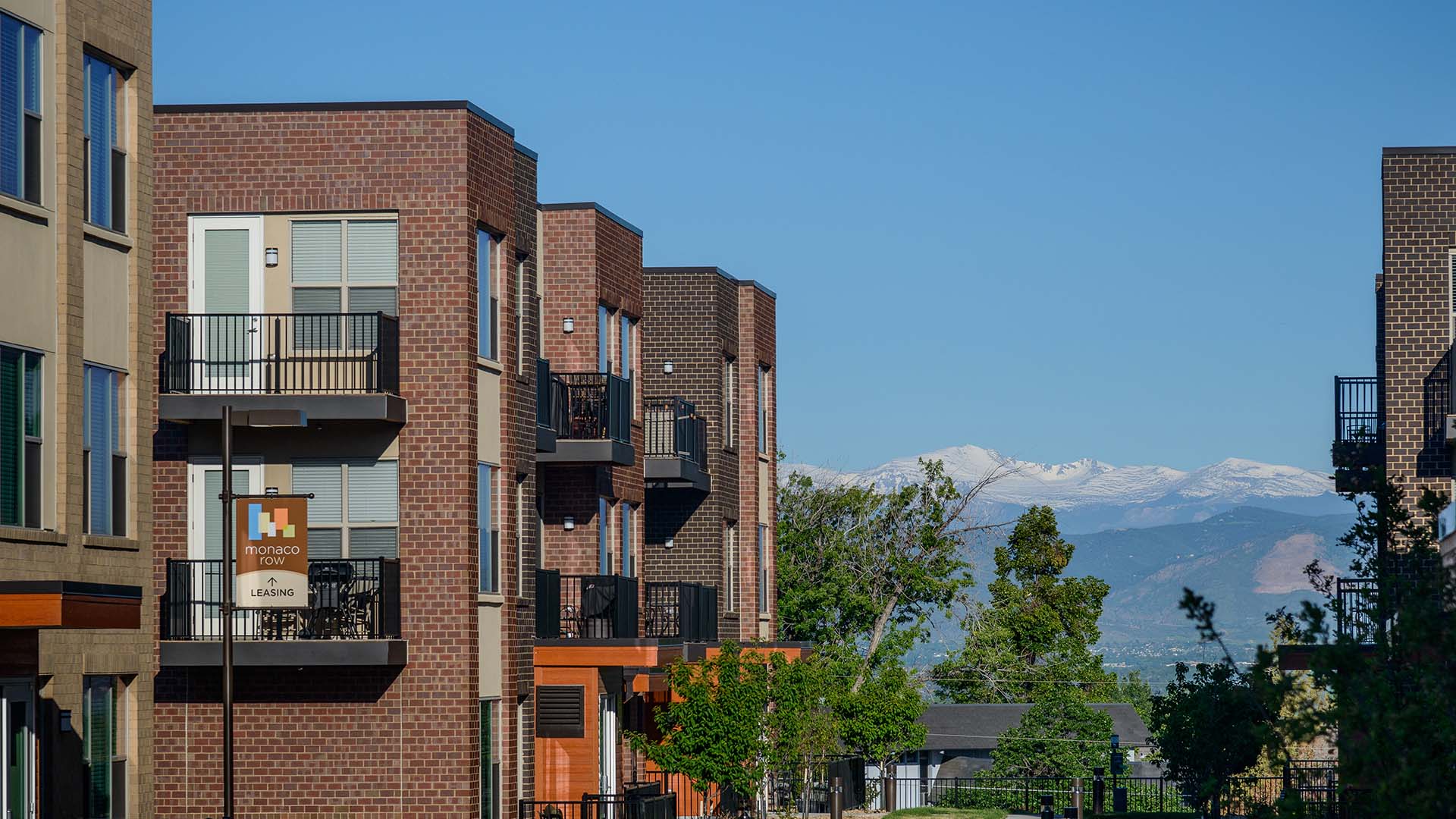 Monaco Row apartments with modern architecture and brick construction.