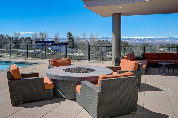 Monaco Row pool area with plush seating and fire pit.