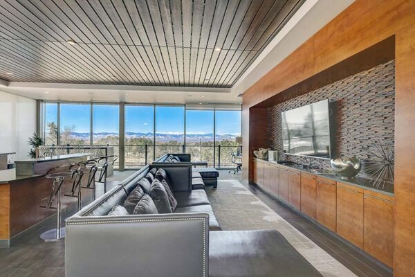 Monaco Row clubhouse with plush seating, large windows, and elegant decor.