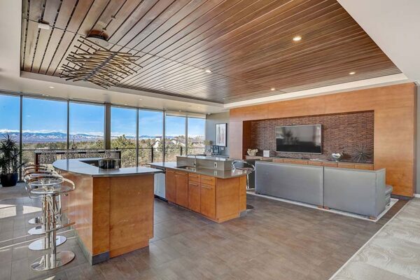 Monaco Row clubhouse with plush seating, large windows, and community kitchen.