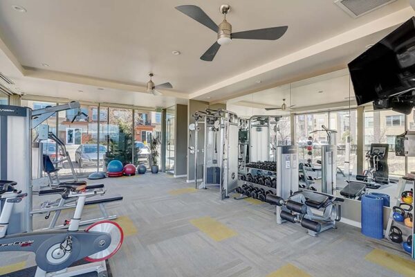 Monaco Row fitness center with cardio machines and weight equipment.