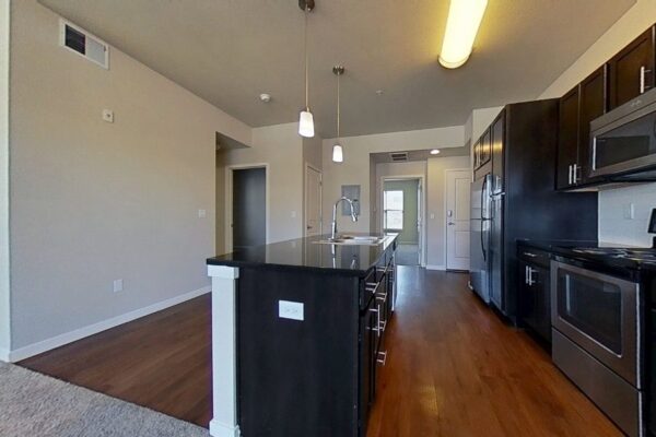 kitchen with island counter with large living room