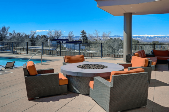 fire pit by a pool deck