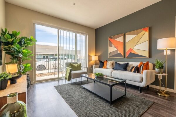 living room with couch, coffee table, and large sliding glass door