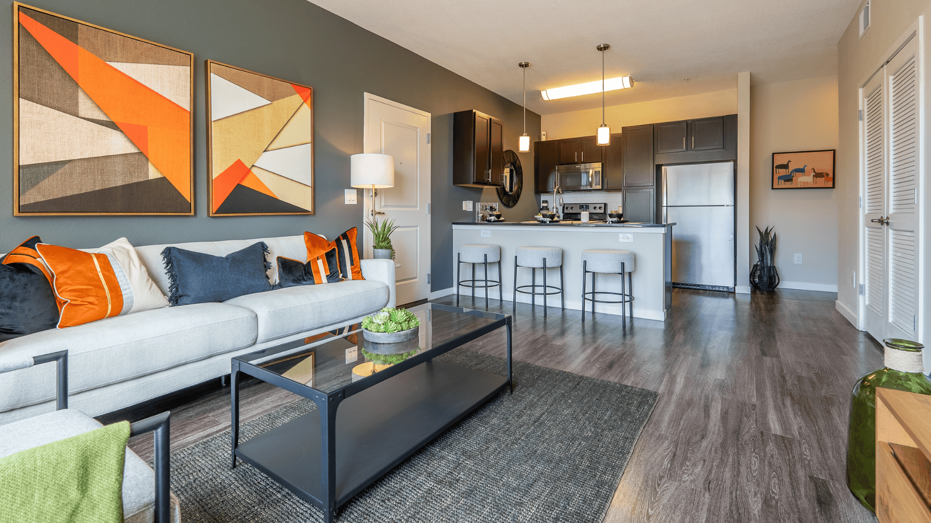 living room leading into kitchen with dark accents