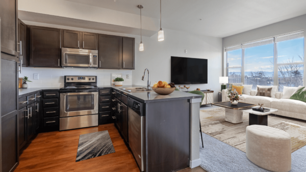 L shapped kitchen with access to kitchen with large windows