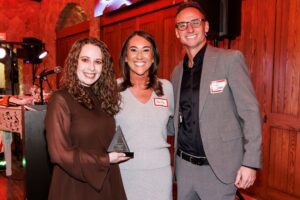 bri ragains accepting community manager of the year award