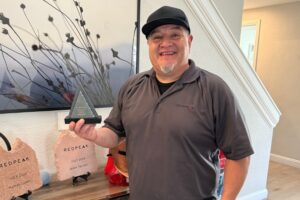 nathan lopez accepting service supervisor of the year award