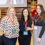 three women smiling for photo
