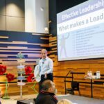 Mark Cukro spekaing on stage at RedPeak's leadership conference