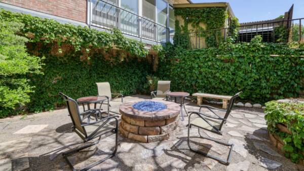 outdoor fire pit surrounded by chairs