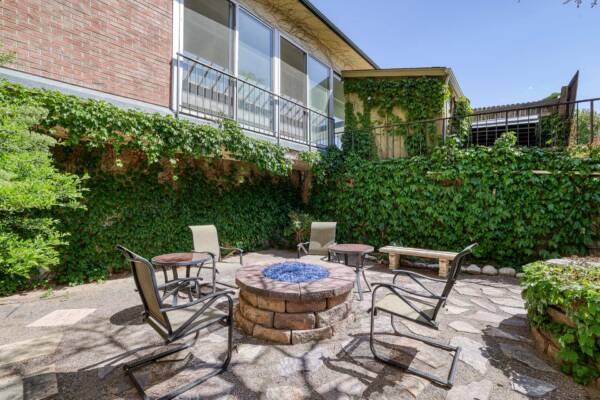 The Manchester community outdoor lounge with firepit and chairs.